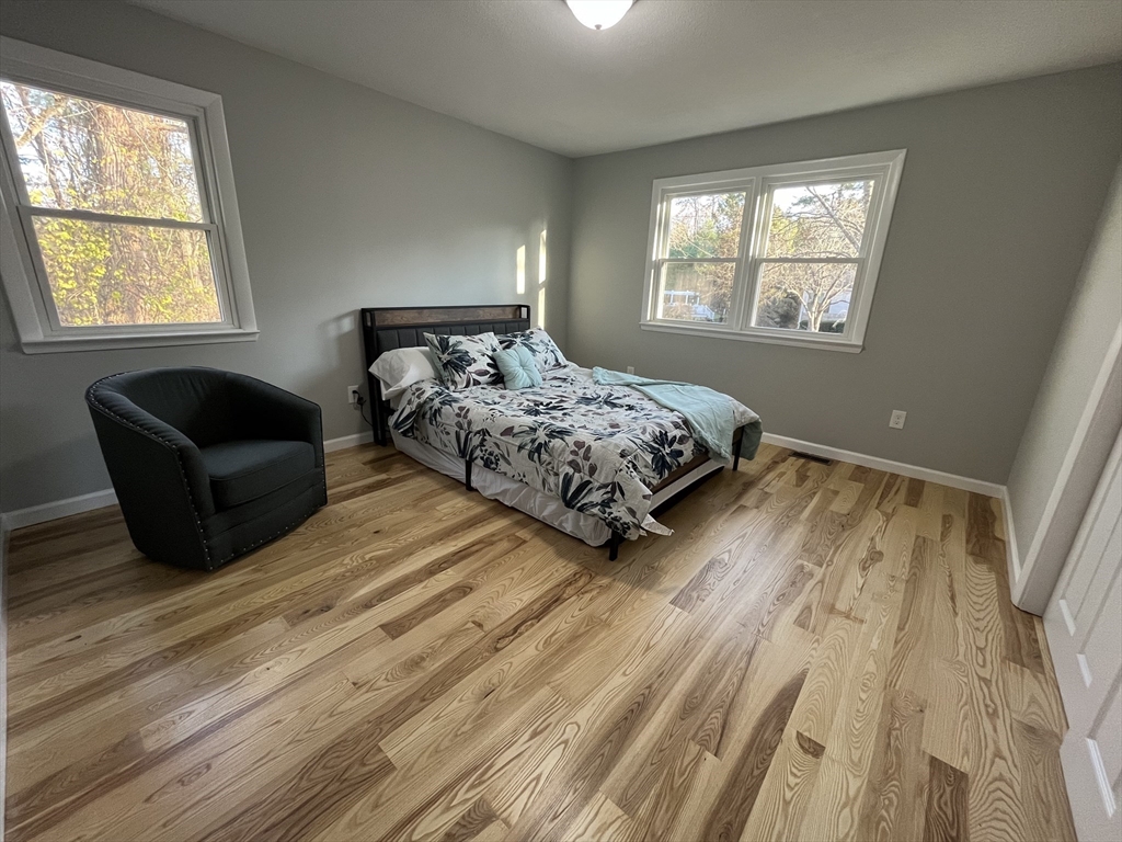 31 Meadow Road Ware, MA 01082 - Photo 12 of 22 a bedroom with a bed and a couch with window