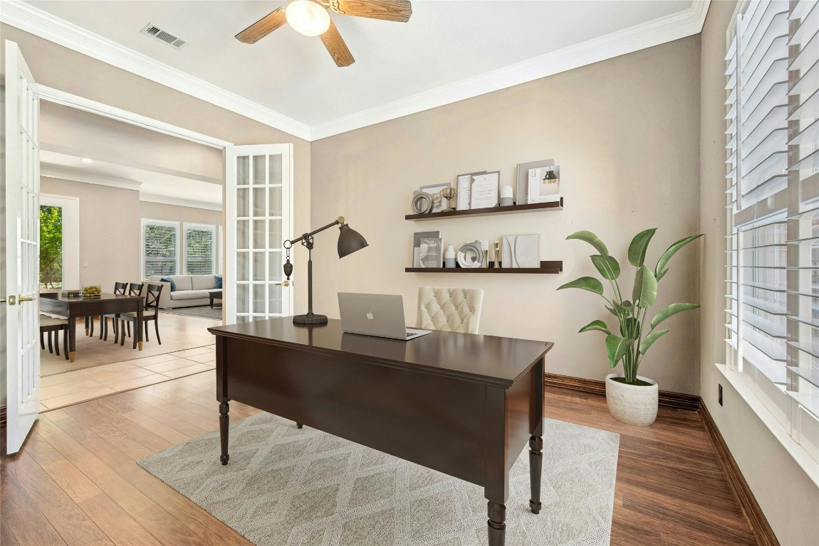 316 Trail Of The Flowers Georgetown, TX 78633 - Photo 17 of 40 a living room with furniture a chandelier and a table