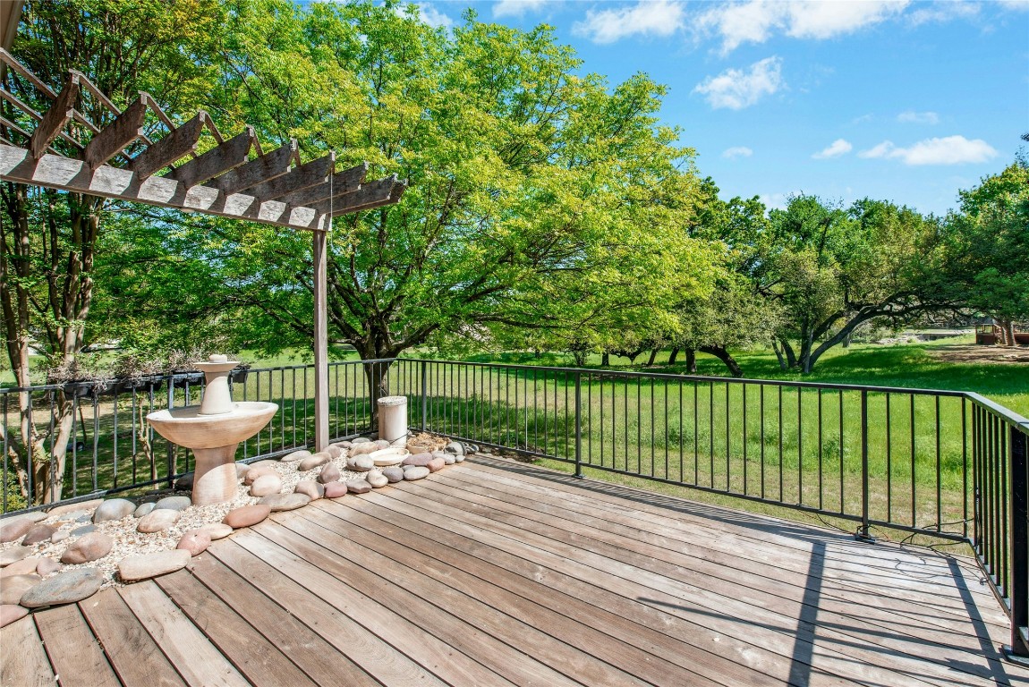 316 Trail Of The Flowers Georgetown, TX 78633 - Photo 33 of 40 a view of a balcony with chair and wooden fence