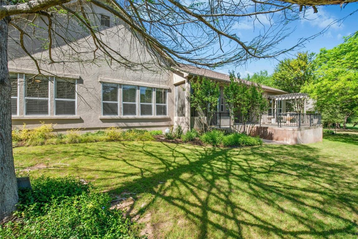 316 Trail Of The Flowers Georgetown, TX 78633 - Photo 34 of 40 a view of a house with a small yard and plants