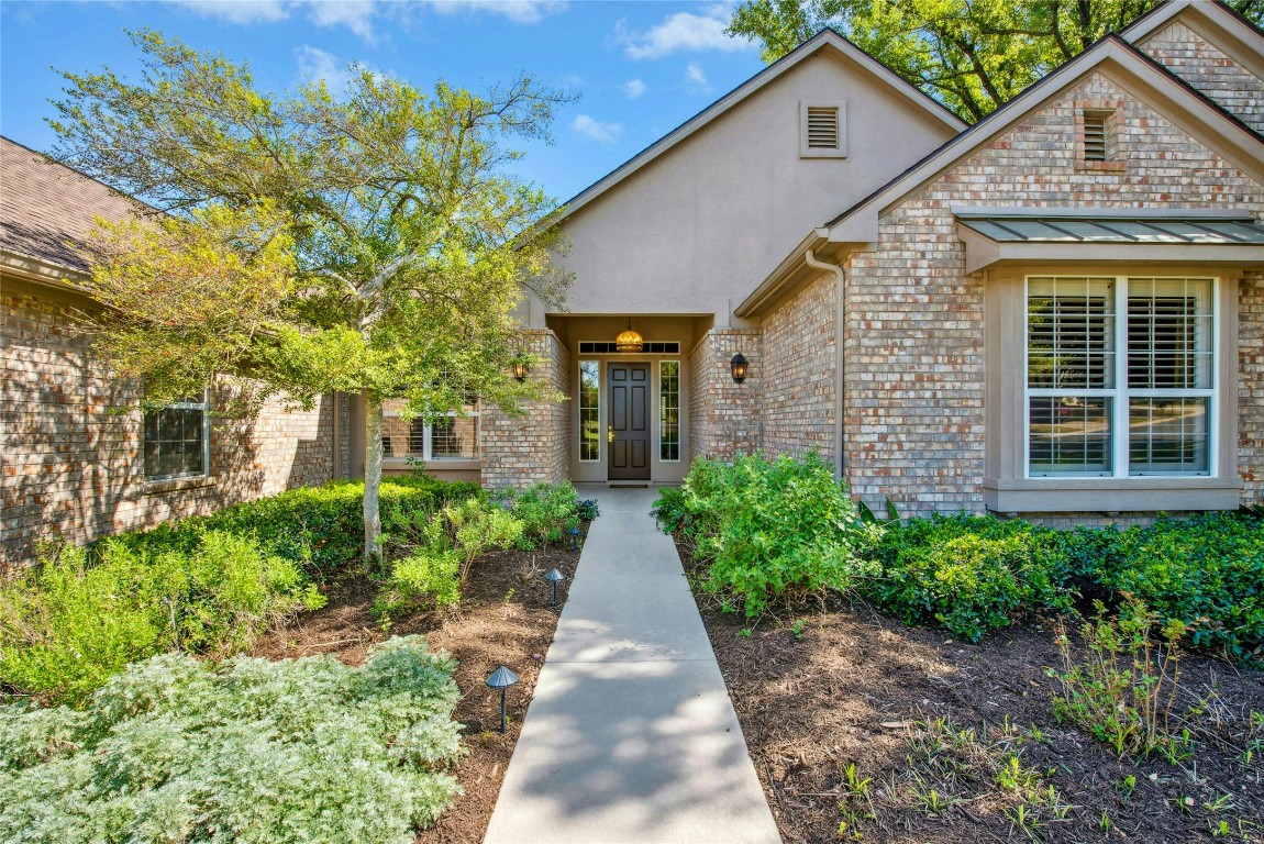 316 Trail Of The Flowers Georgetown, TX 78633 - Photo 4 of 40 a front view of a house with garden