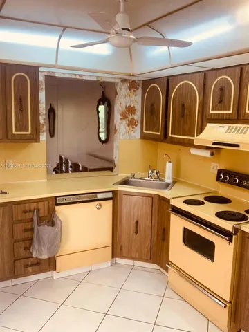 a kitchen with stainless steel appliances granite countertop a stove and a sink