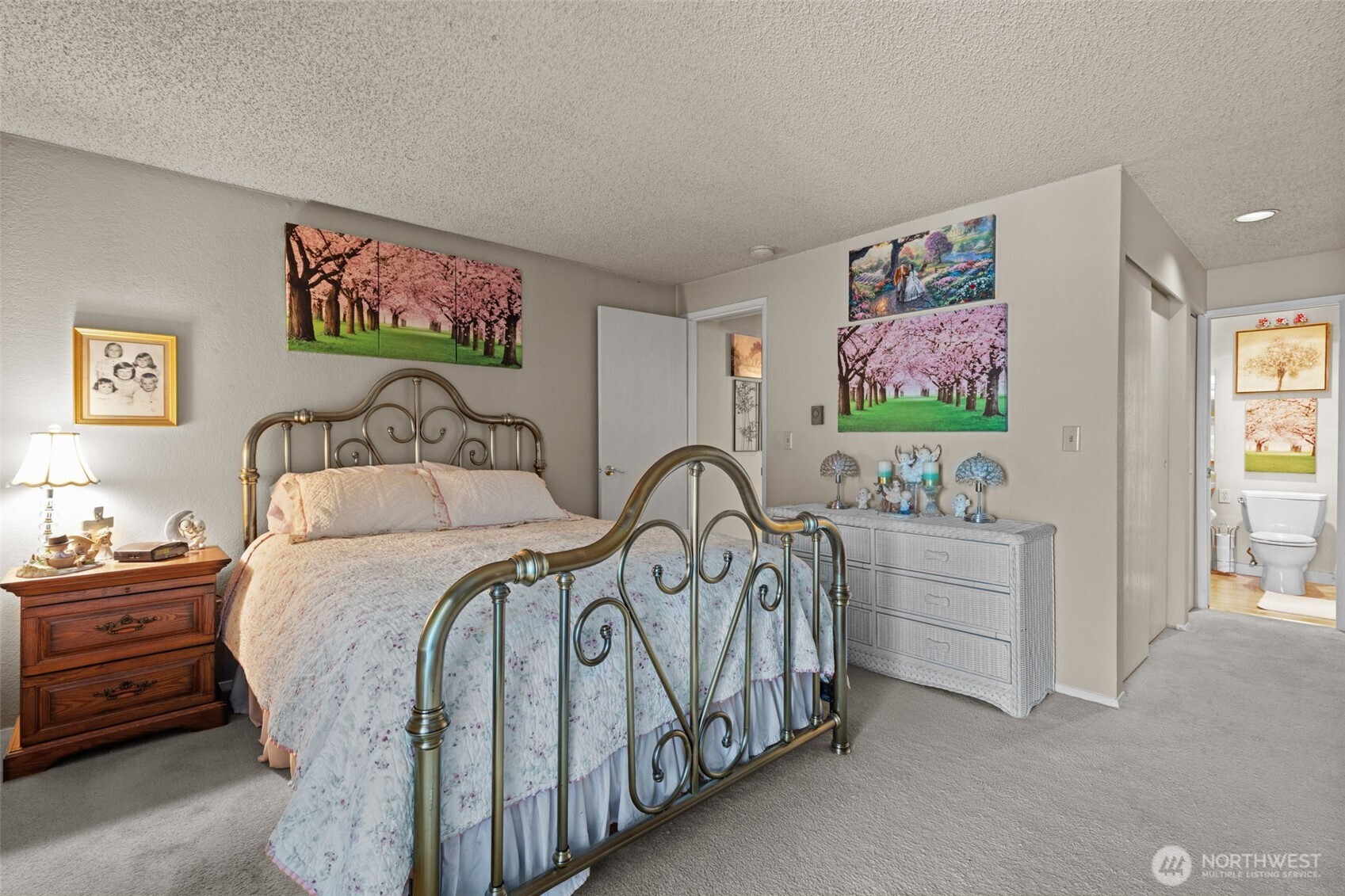 2517 Northeast 4th Street, Unit 523 Renton, WA 98056 - Photo 20 of 32 a bedroom with furniture and a flat screen tv