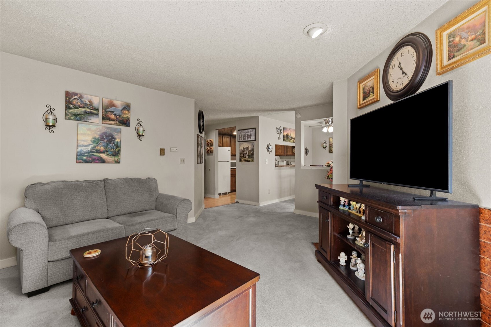 2517 Northeast 4th Street, Unit 523 Renton, WA 98056 - Photo 5 of 32 a living room with furniture and a flat screen tv