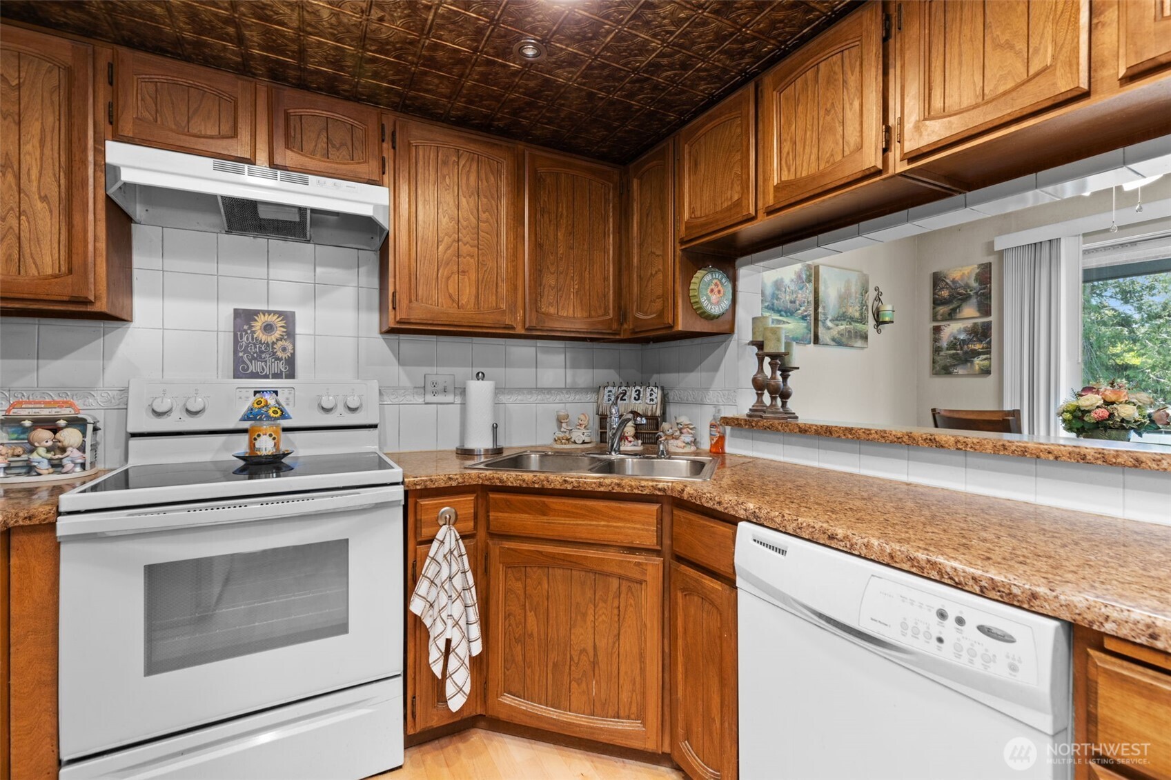 2517 Northeast 4th Street, Unit 523 Renton, WA 98056 - Photo 9 of 32 a kitchen with granite countertop cabinets stainless steel appliances and a sink