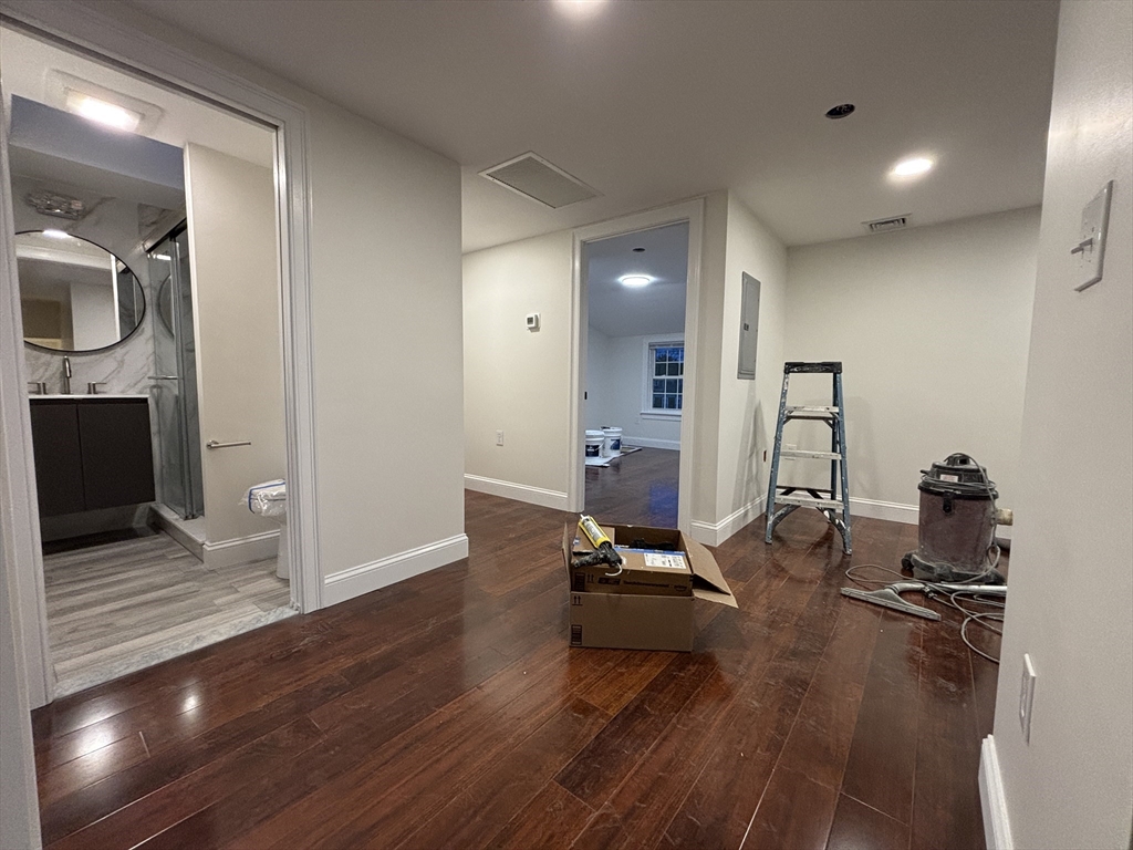 4 Appleton Street, Unit D Quincy, MA 02171 - Photo 12 of 12 a view of a room with wooden floor