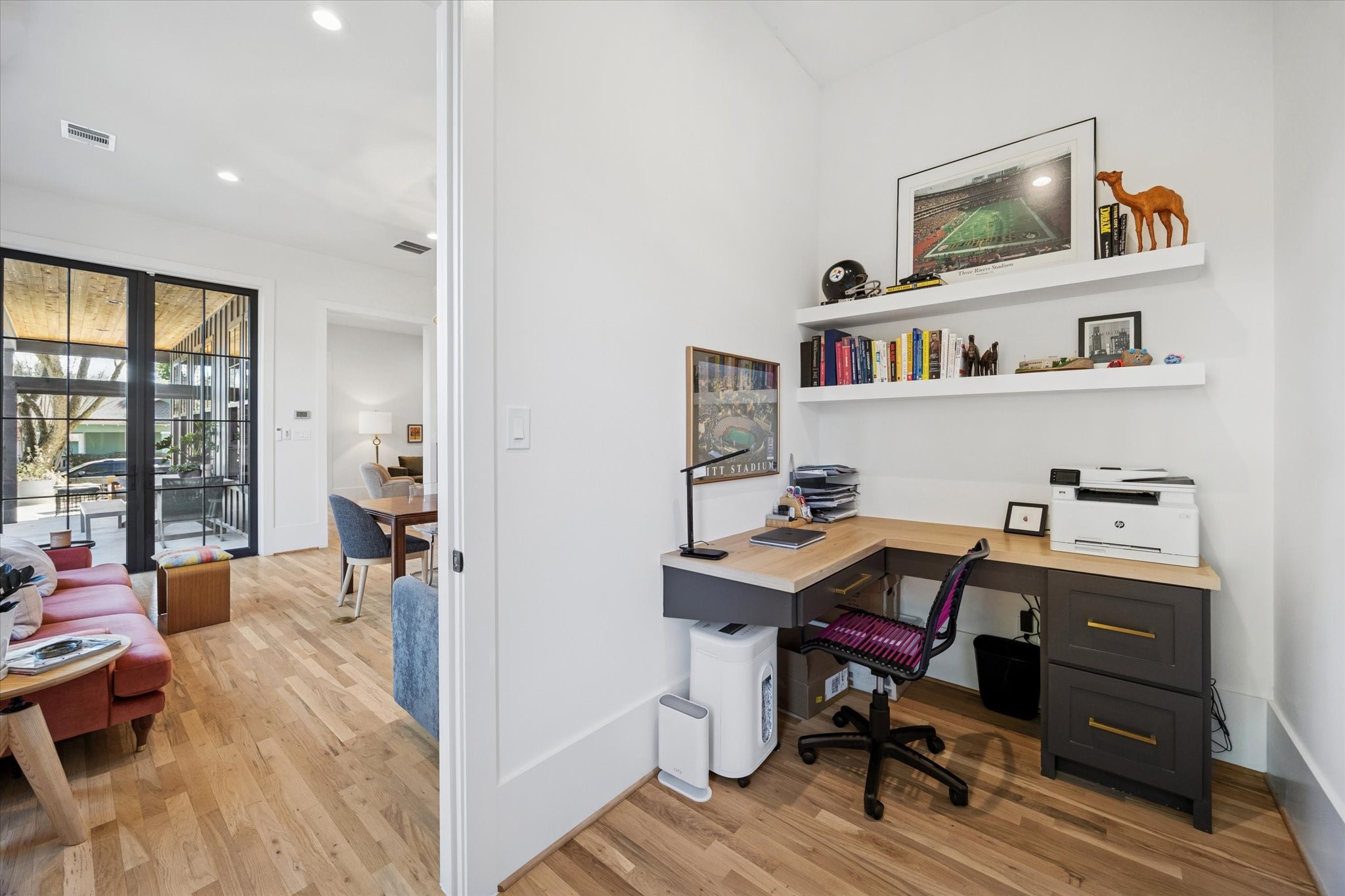 701 Ridge Street Houston, TX 77009 - Photo 13 of 50 A dedicated home office with custom built-ins is conveniently located near the heart of the home.
