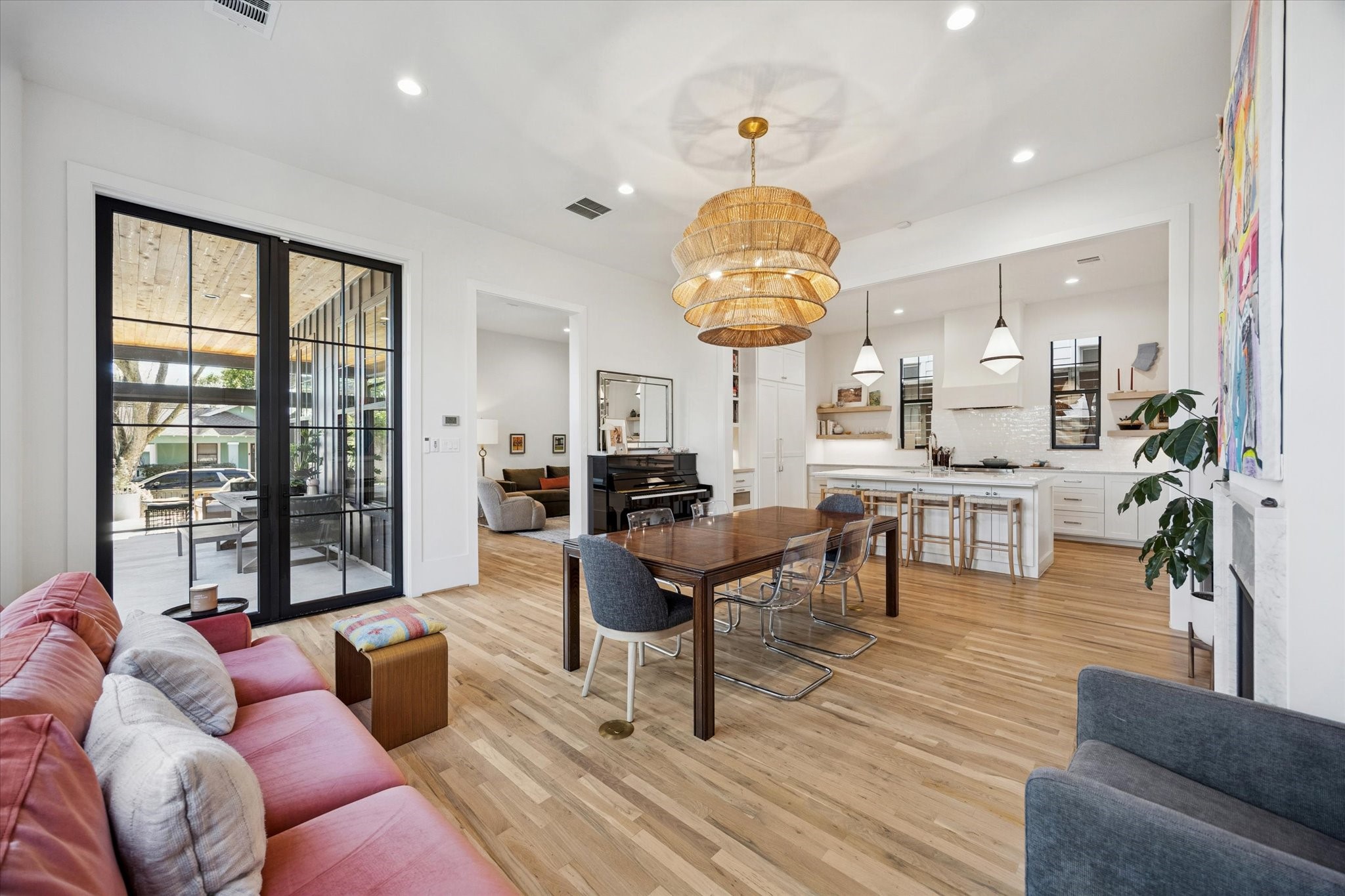 701 Ridge Street Houston, TX 77009 - Photo 14 of 50 Steel French doors open to the side yard patio, creating effortless indoor-outdoor living.