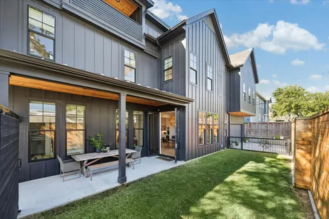 a view of backyard with patio
