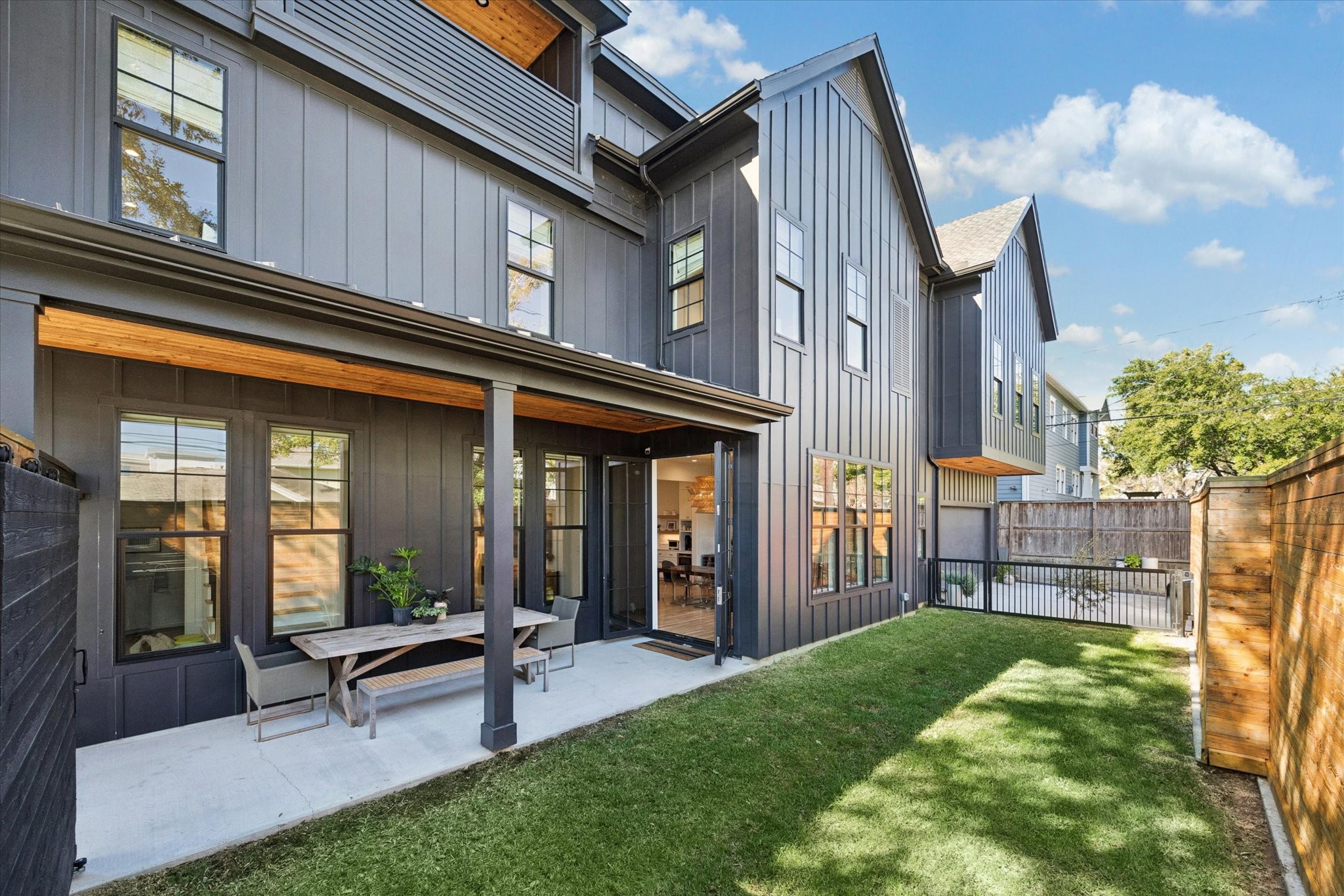 701 Ridge Street Houston, TX 77009 - Photo 15 of 50 Fully gated side yard designed for outdoor enjoyment, with sliding doors and wrought-iron gate that can remain open or secured.