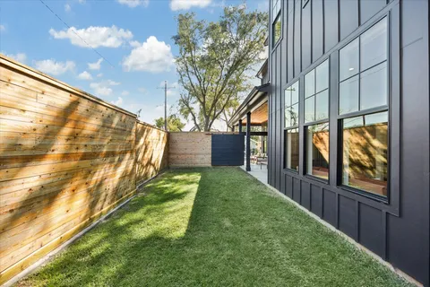 a kitchen with stainless steel appliances granite countertop a stove a sink and a wooden floor