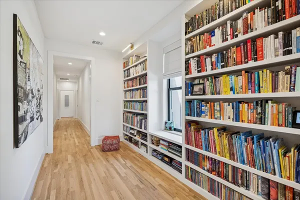 a living room with lots of books