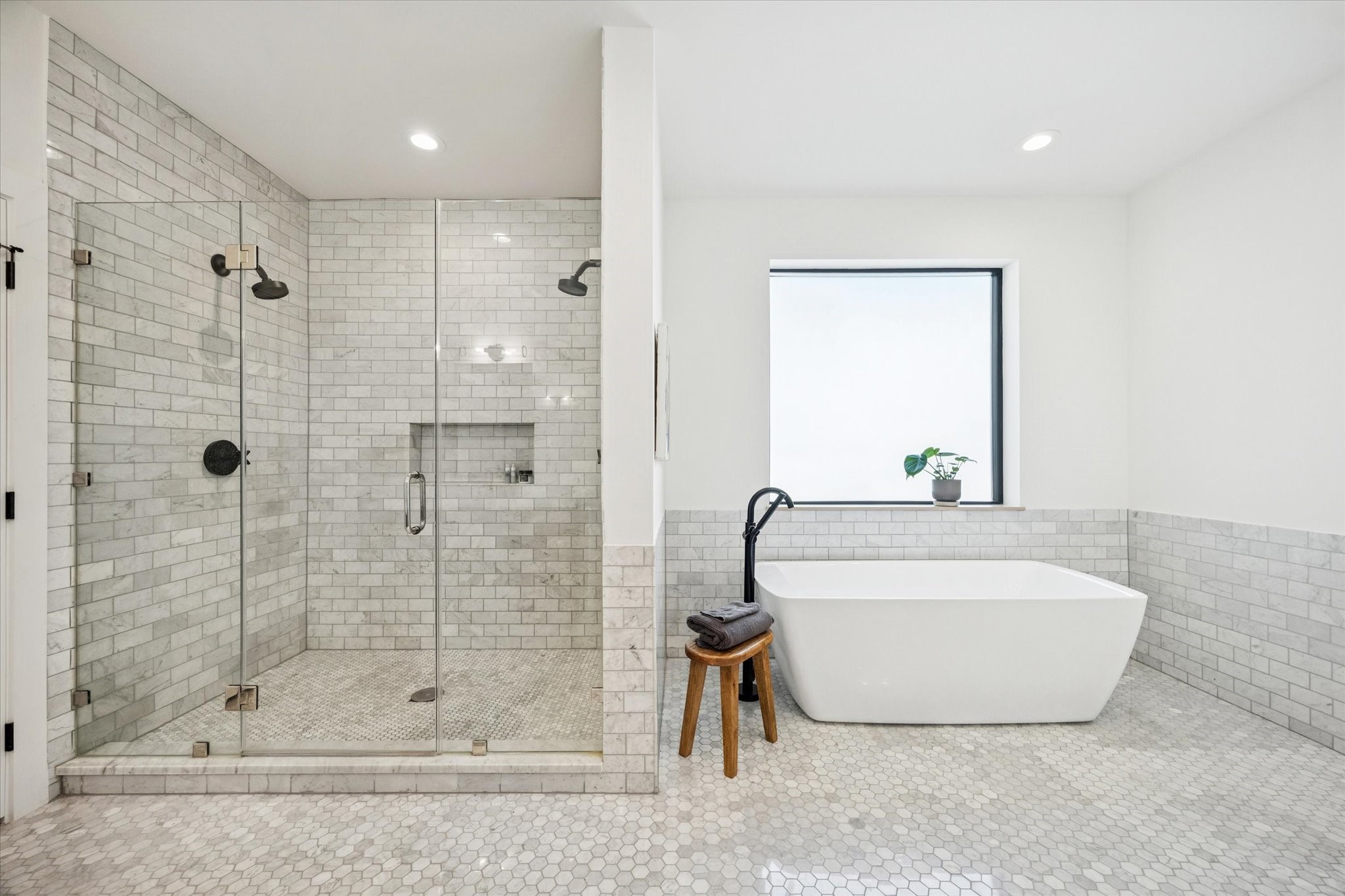 701 Ridge Street Houston, TX 77009 - Photo 34 of 50 Alternate view of stunning shower with floor to ceiling tile and luxurious double shower heads.