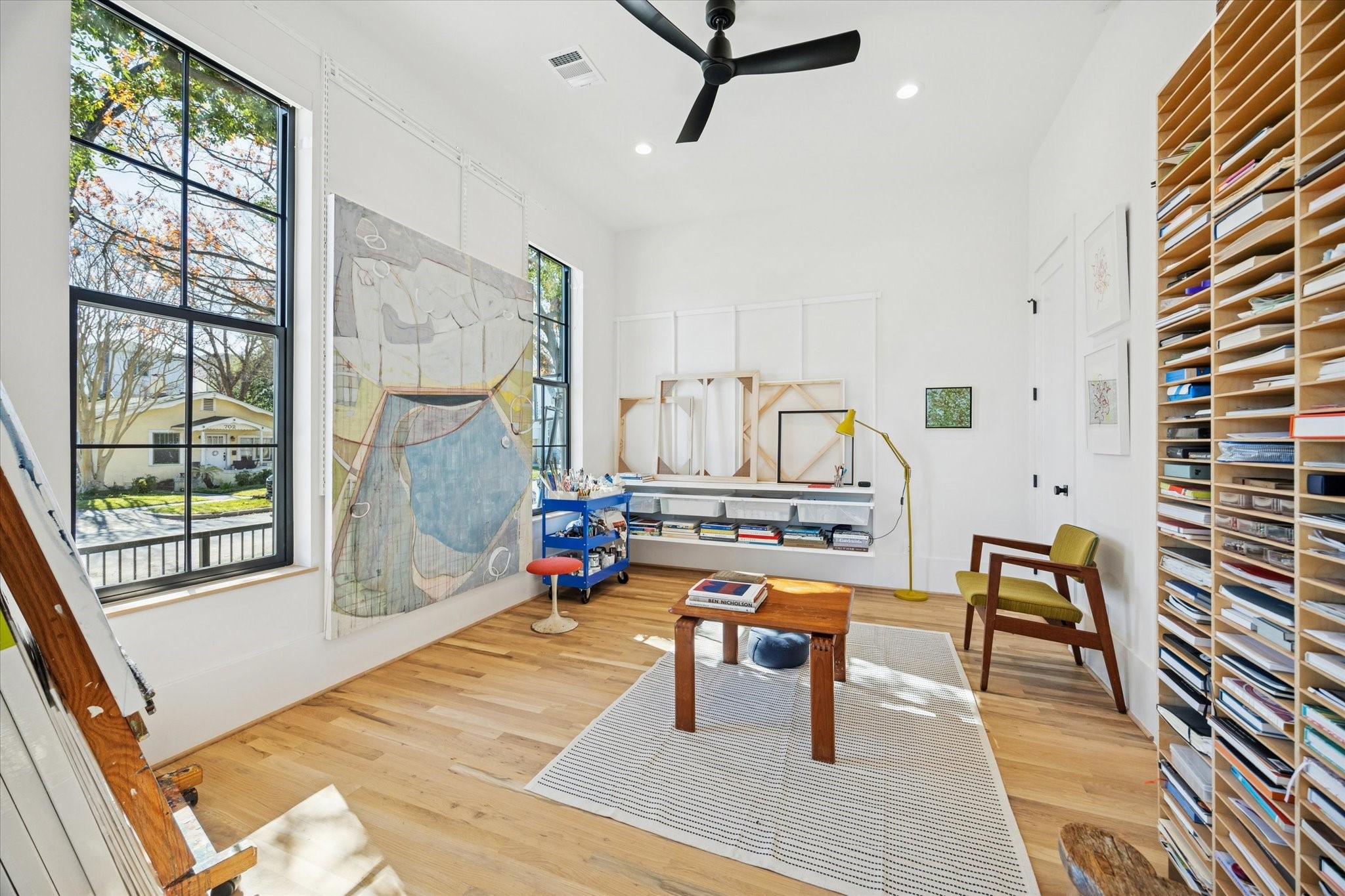 701 Ridge Street Houston, TX 77009 - Photo 6 of 50 Alternate view of the first-floor bedroom, currently styled as an art studio, featuring a walk-in closet.