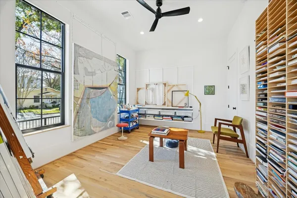 a room with lots of furniture and windows