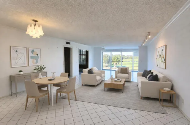 a view of a livingroom with furniture and window
