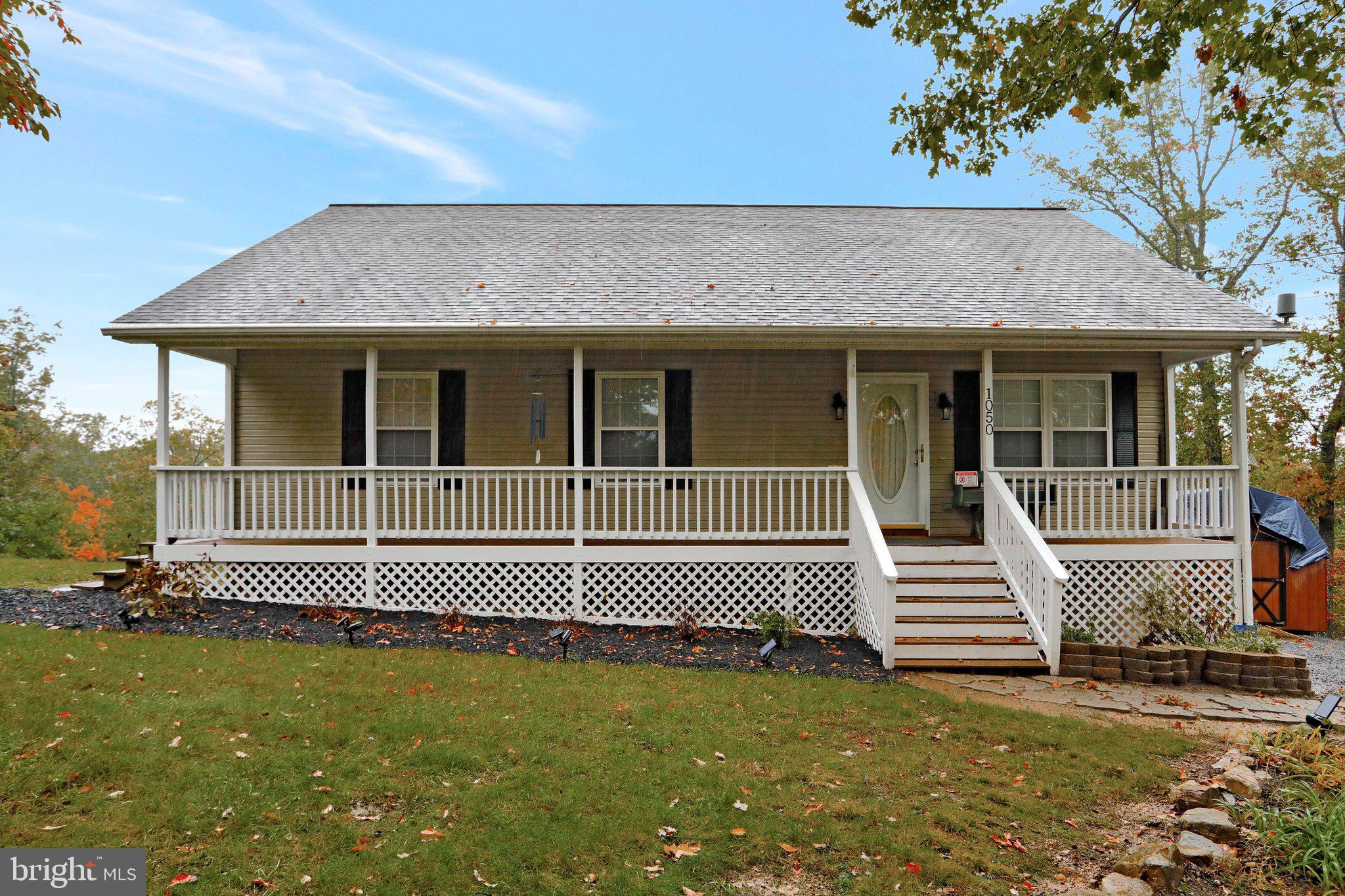 1050 Lower Valley Road Strasburg, VA 22657 - Photo 1 of 34 a view of a house with a backyard
