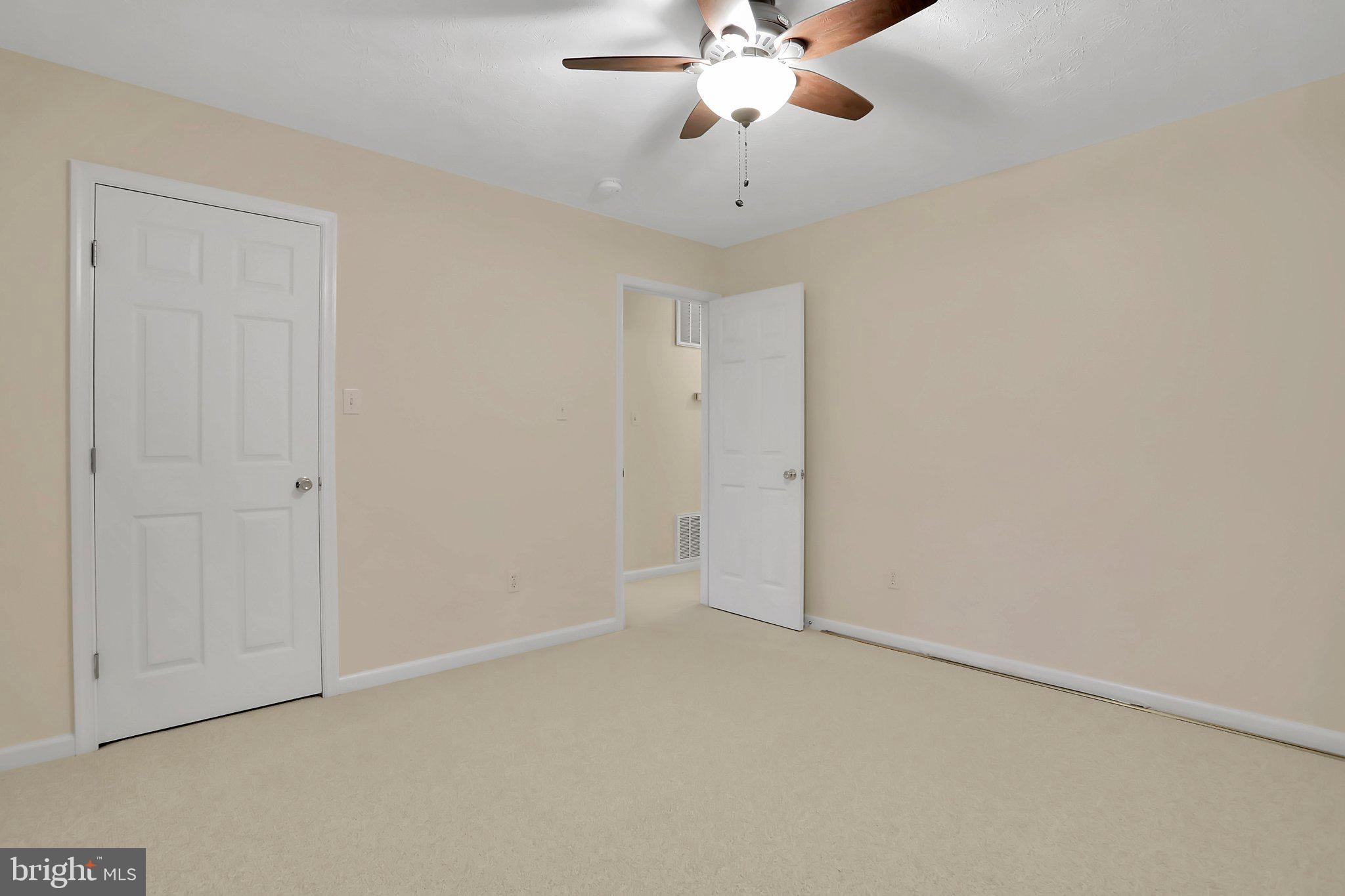 1050 Lower Valley Road Strasburg, VA 22657 - Photo 15 of 34 an empty room with a chandelier fan and a chandelier fan