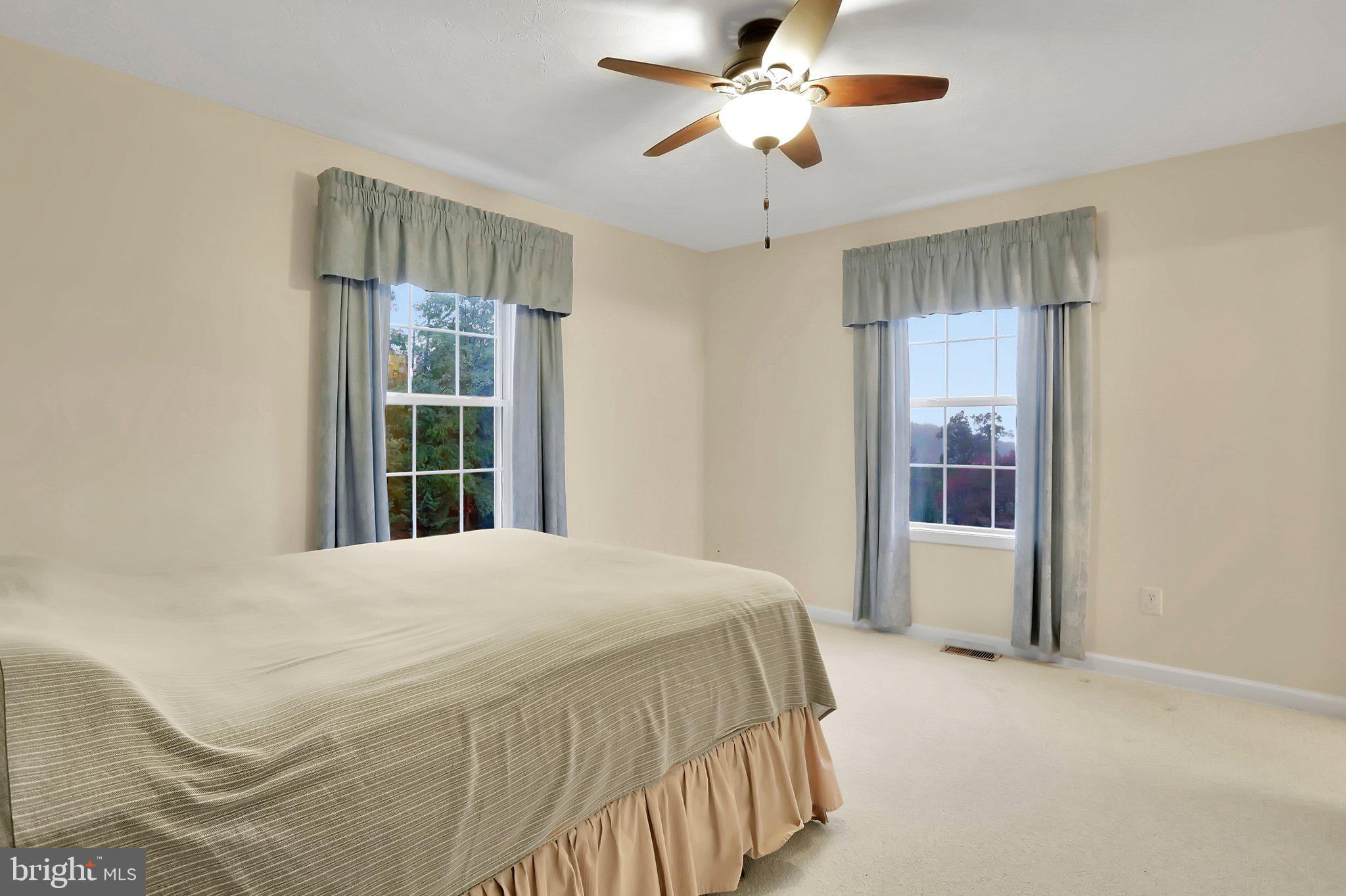 1050 Lower Valley Road Strasburg, VA 22657 - Photo 16 of 34 a bedroom with a large bed and a window