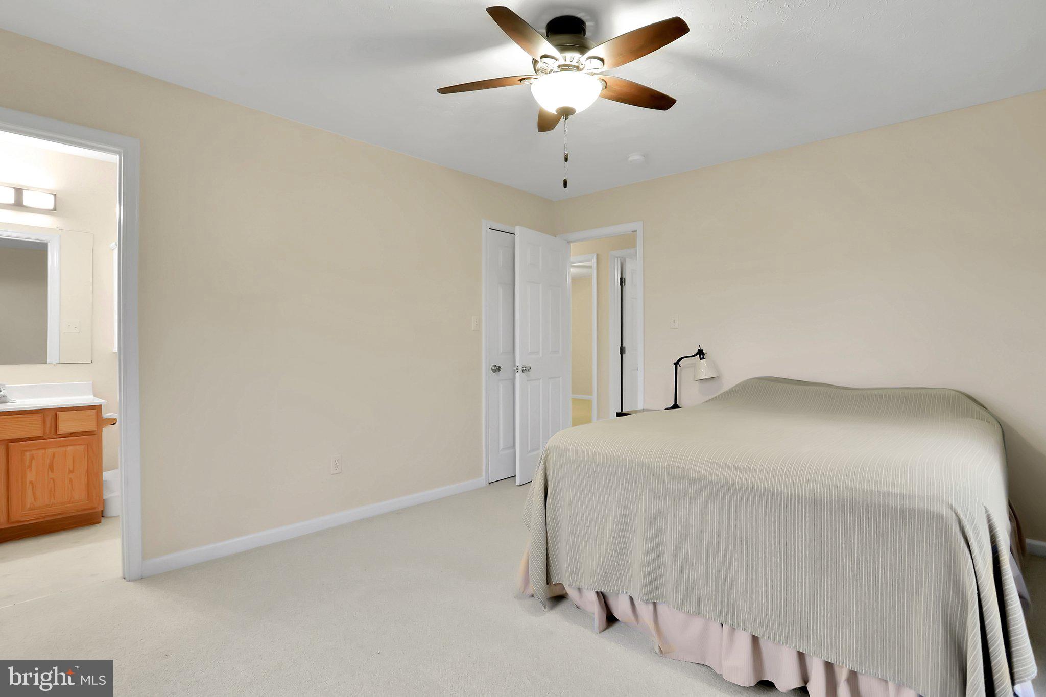 1050 Lower Valley Road Strasburg, VA 22657 - Photo 18 of 34 a bedroom with a bed and a chandelier