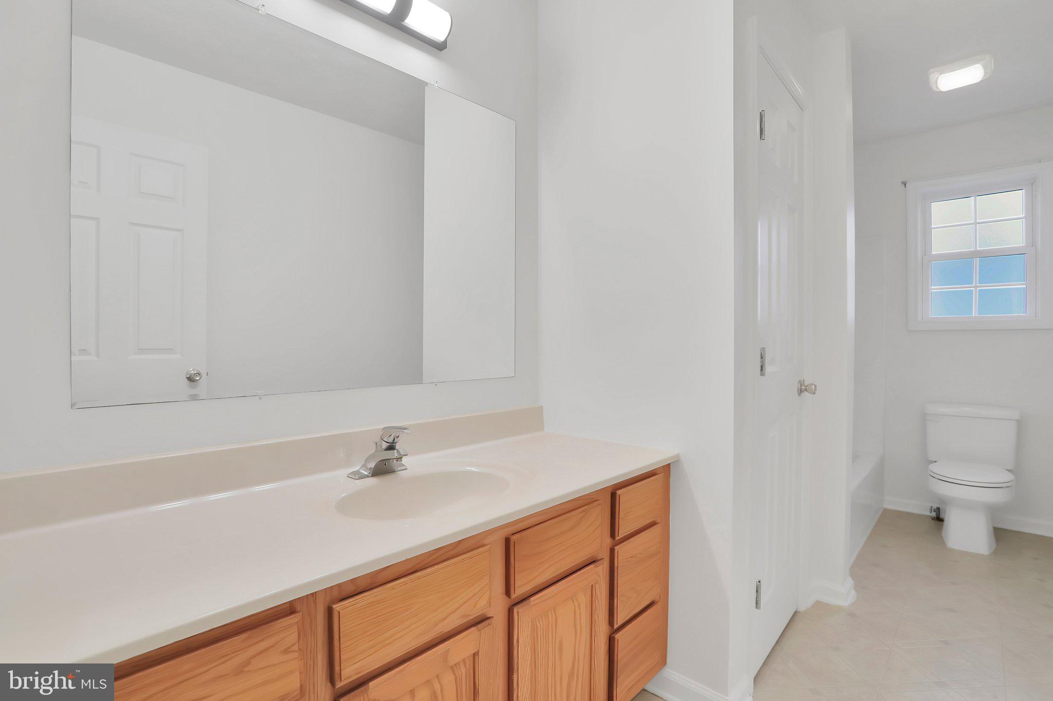 1050 Lower Valley Road Strasburg, VA 22657 - Photo 20 of 34 a bathroom with a sink toilet and vanity