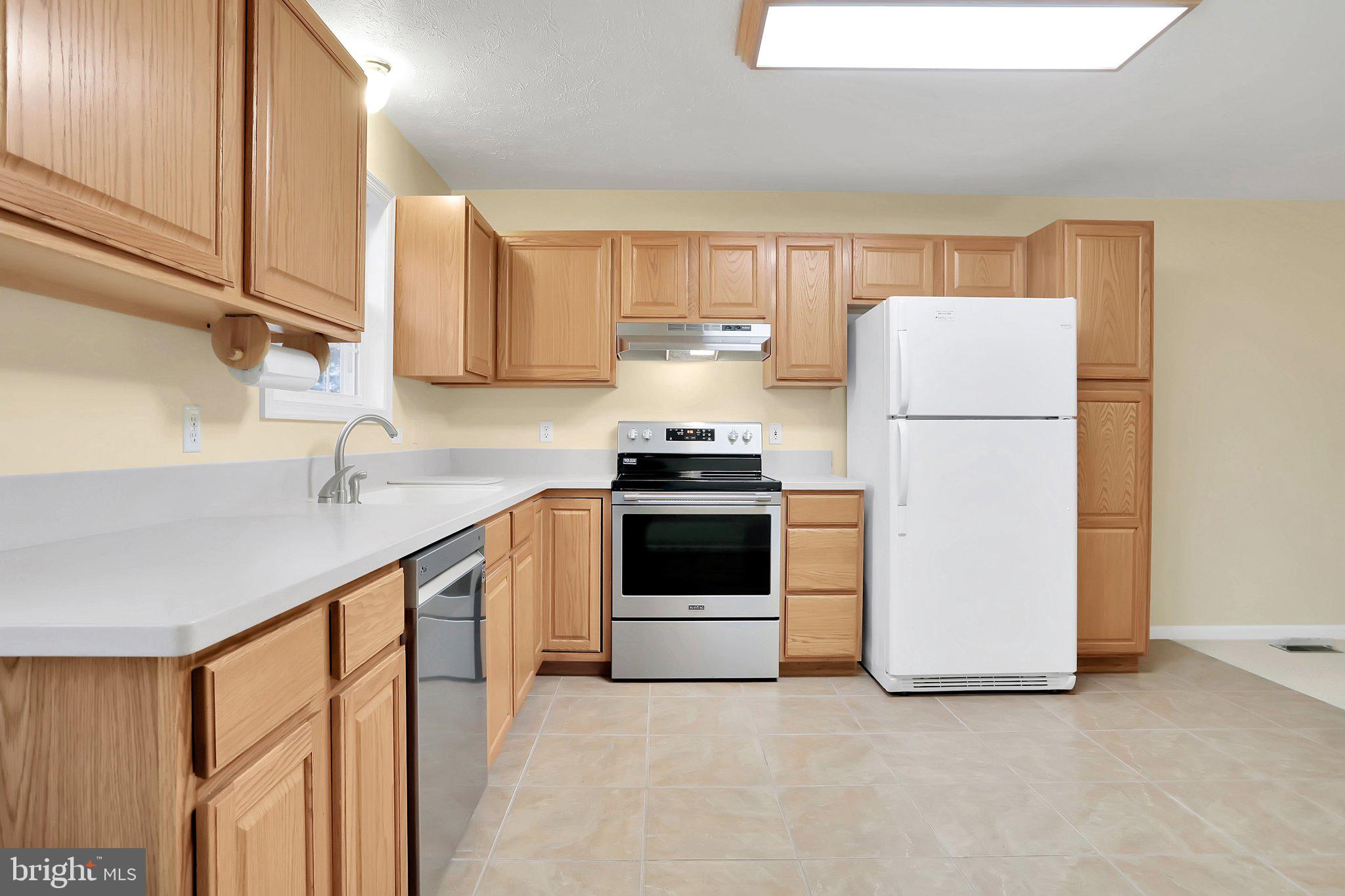 1050 Lower Valley Road Strasburg, VA 22657 - Photo 7 of 34 a kitchen with a refrigerator sink and cabinets
