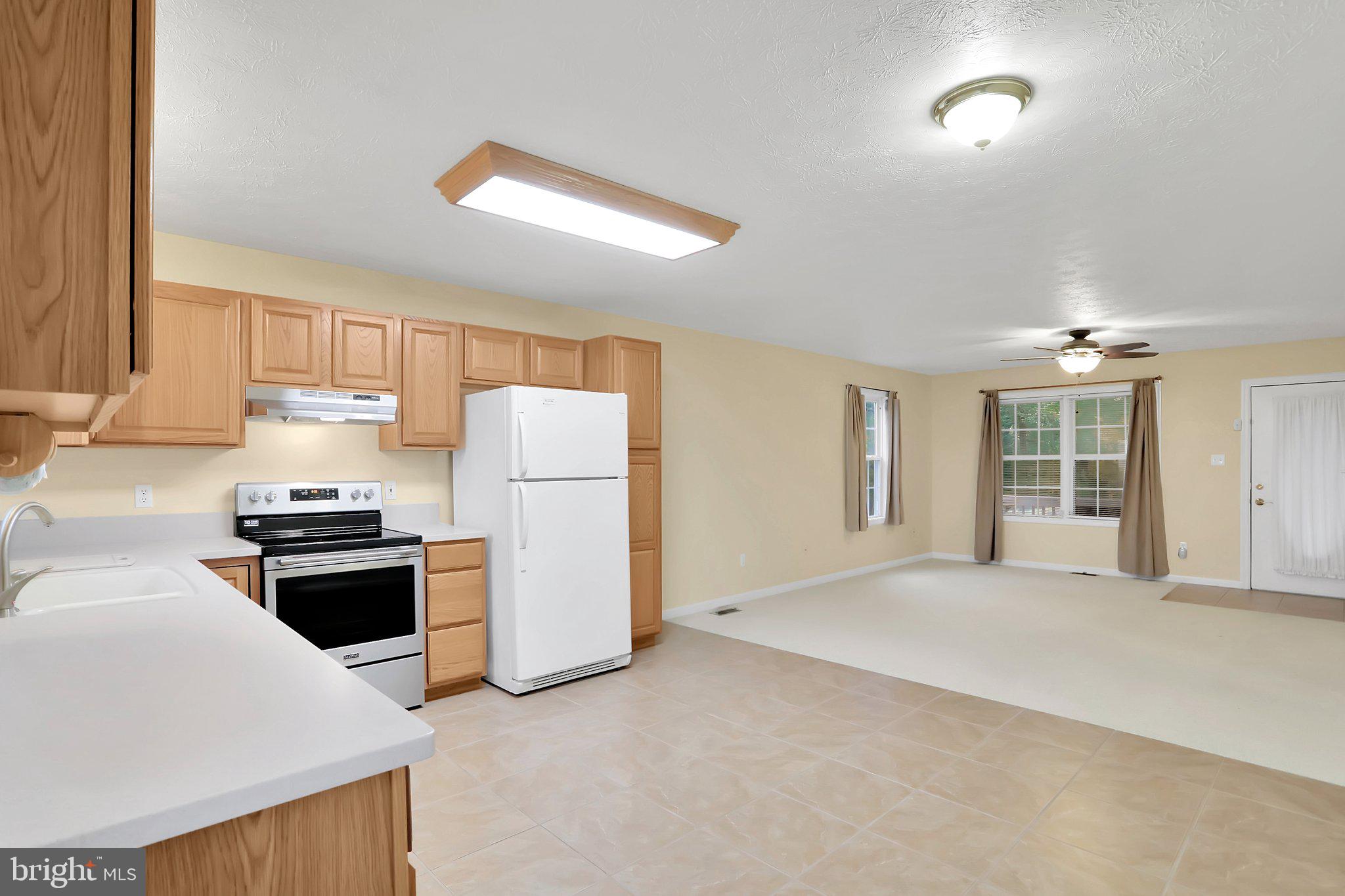 1050 Lower Valley Road Strasburg, VA 22657 - Photo 8 of 34 a kitchen with a stove a refrigerator and a sink