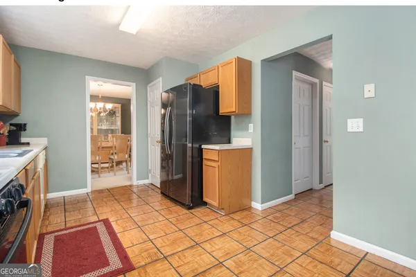 a kitchen with stainless steel appliances a refrigerator and a stove