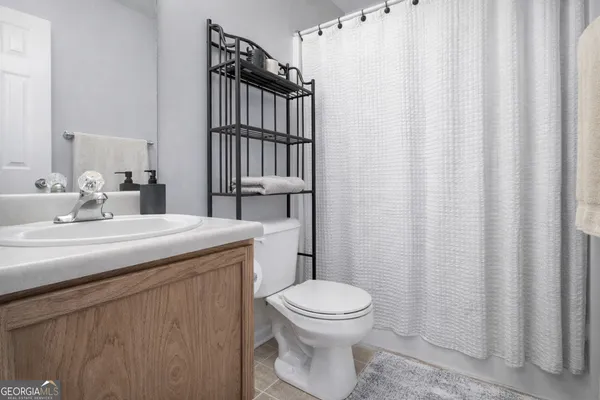 a bathroom with a toilet a sink and a bathtub