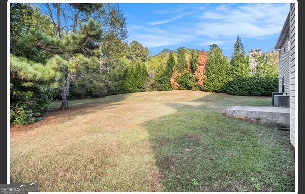 a view of a yard with an trees