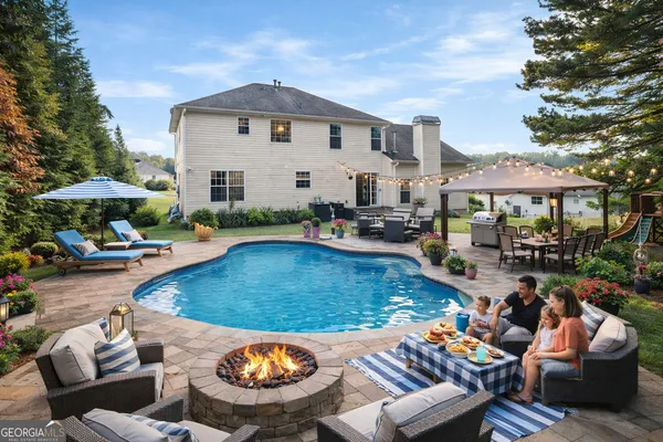 a view of a swimming pool with a patio