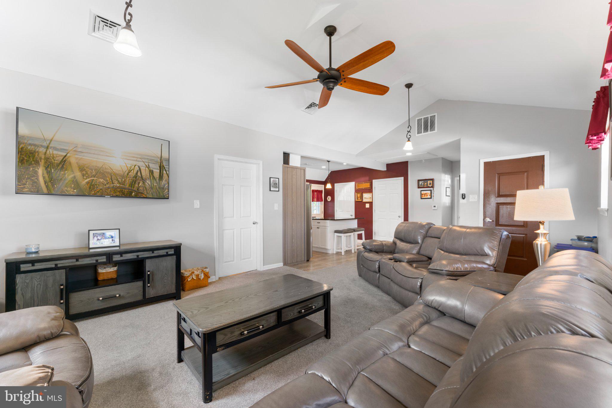 1748 Larkin Road Upper Chichester, PA 19061 - Photo 29 of 32 a living room with furniture and kitchen view