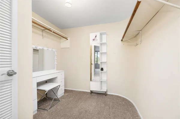 a view of room with workspace and a window