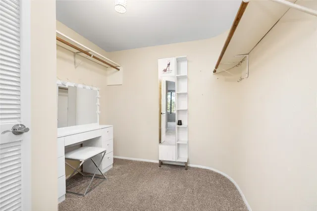 a view of room with workspace and a window