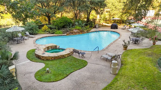 a view of a swimming pool with an outdoor space