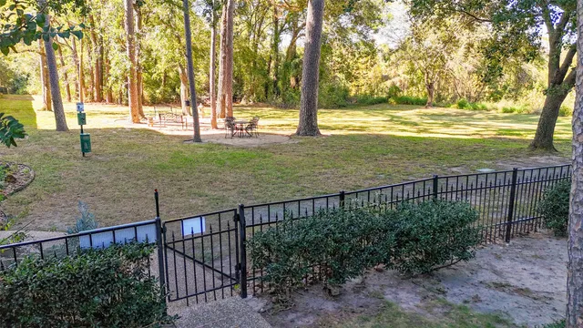 a front view of a building with a garden