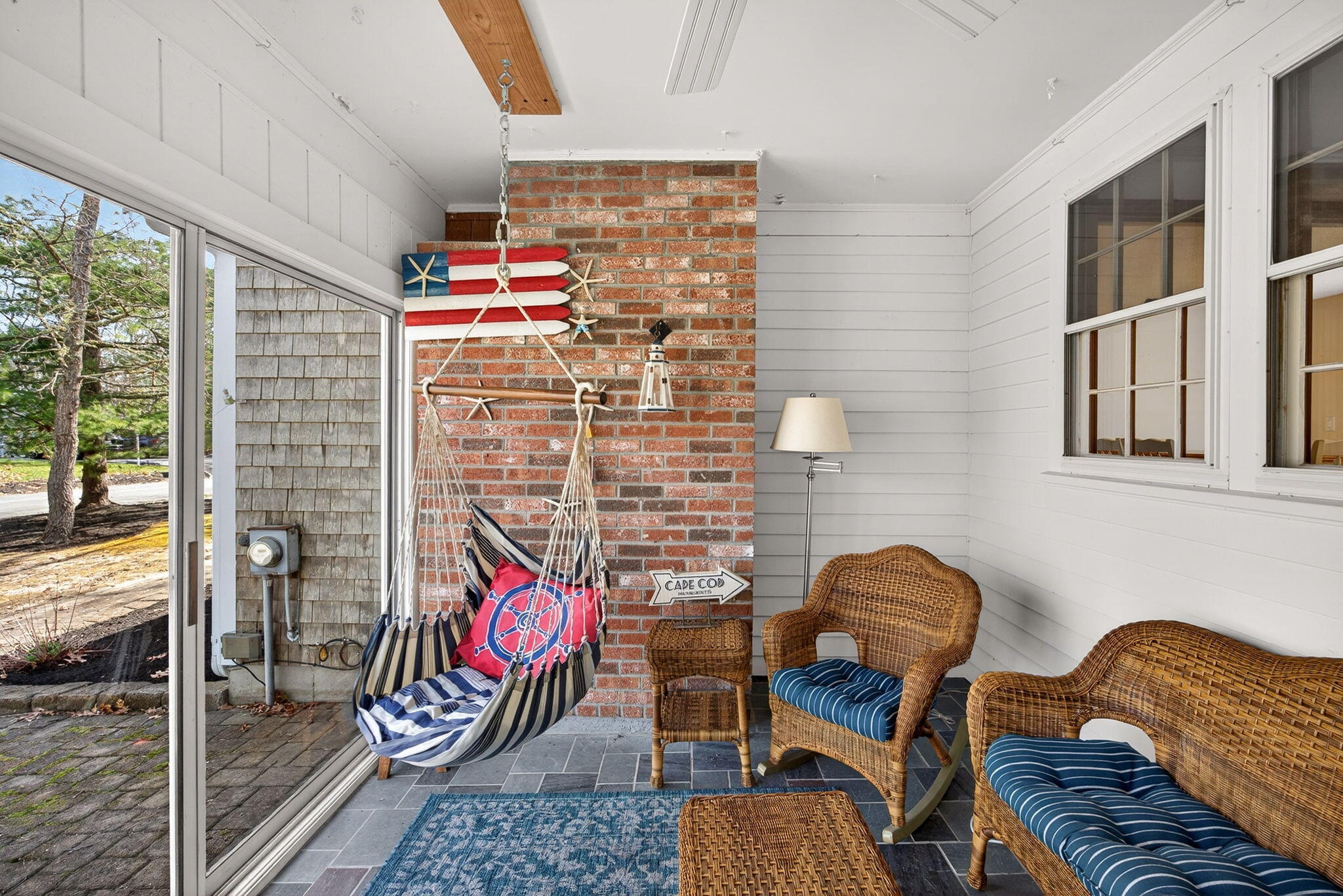 12 Inkberry Lane Harwich, MA 02645 - Photo 13 of 41 a backyard of a house with wooden floor and furniture