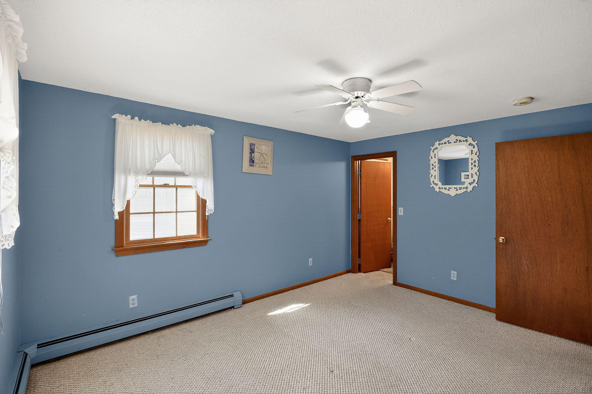 12 Inkberry Lane Harwich, MA 02645 - Photo 15 of 41 an empty room with windows and fan