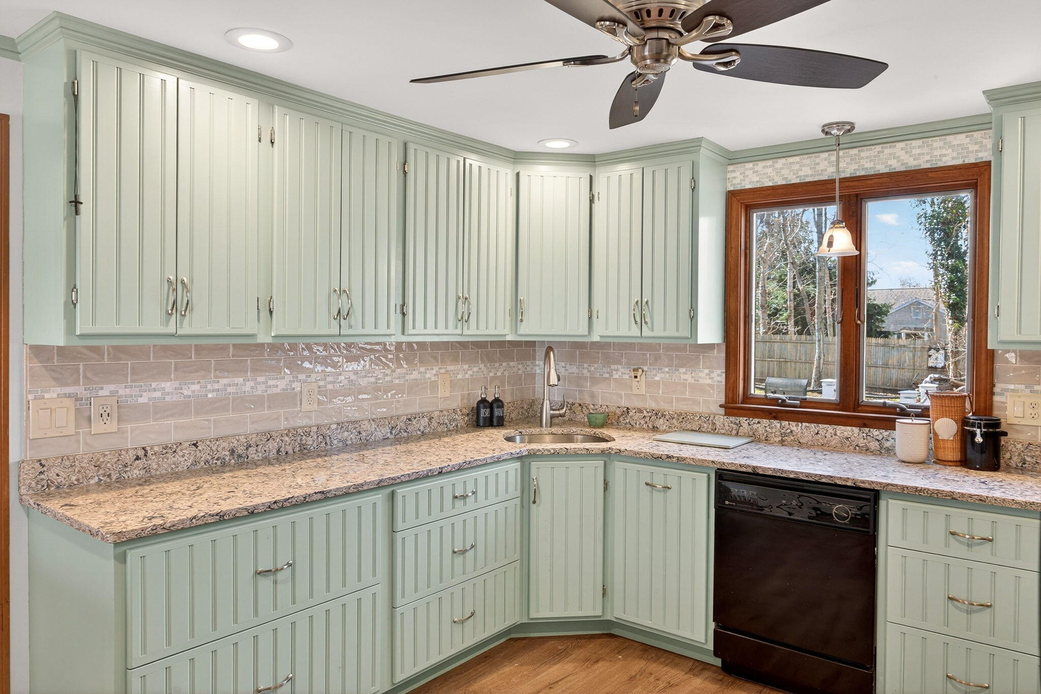 12 Inkberry Lane Harwich, MA 02645 - Photo 2 of 41 a kitchen with a sink cabinets and window