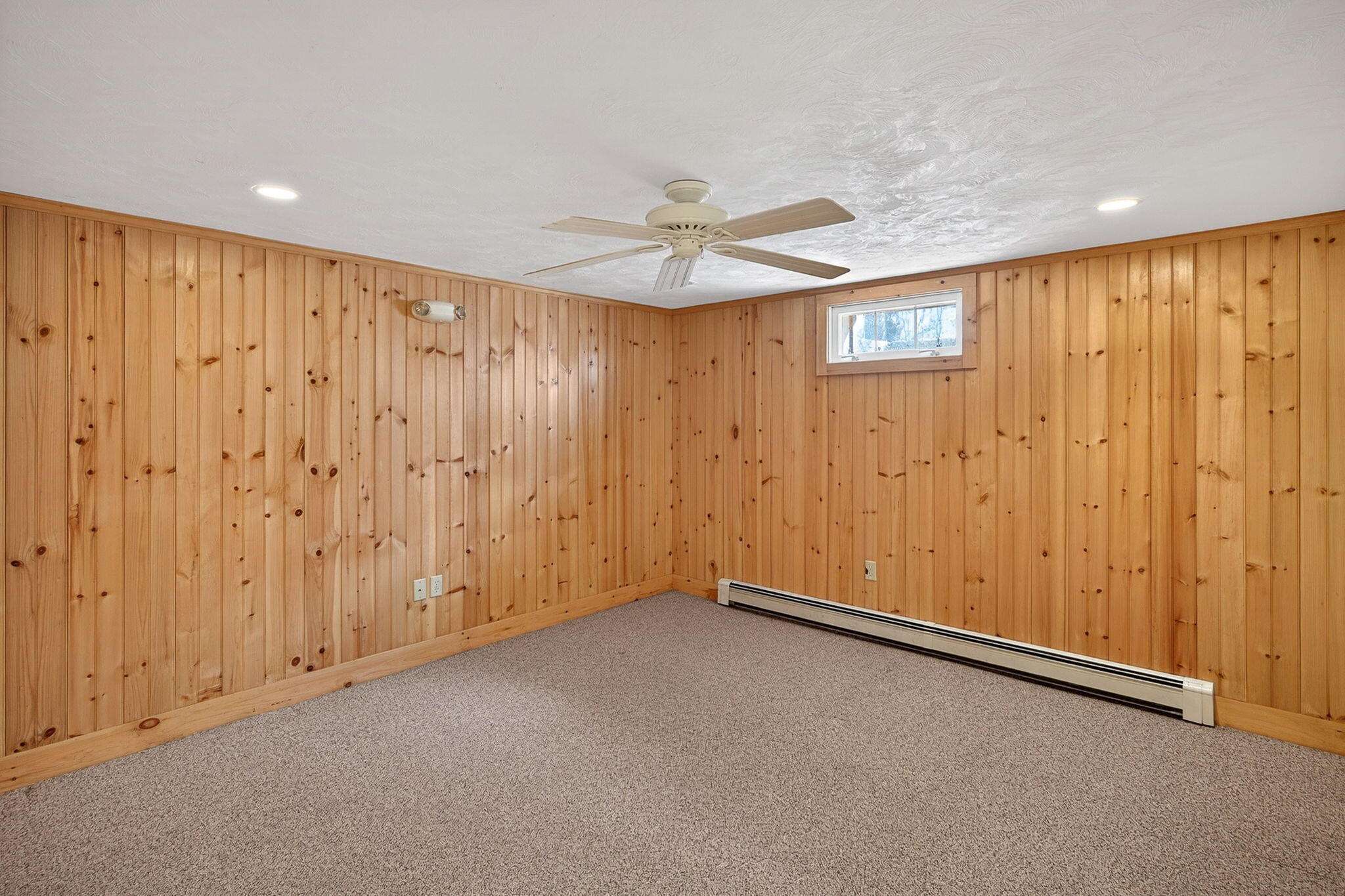 12 Inkberry Lane Harwich, MA 02645 - Photo 25 of 41 an empty room with windows and fan