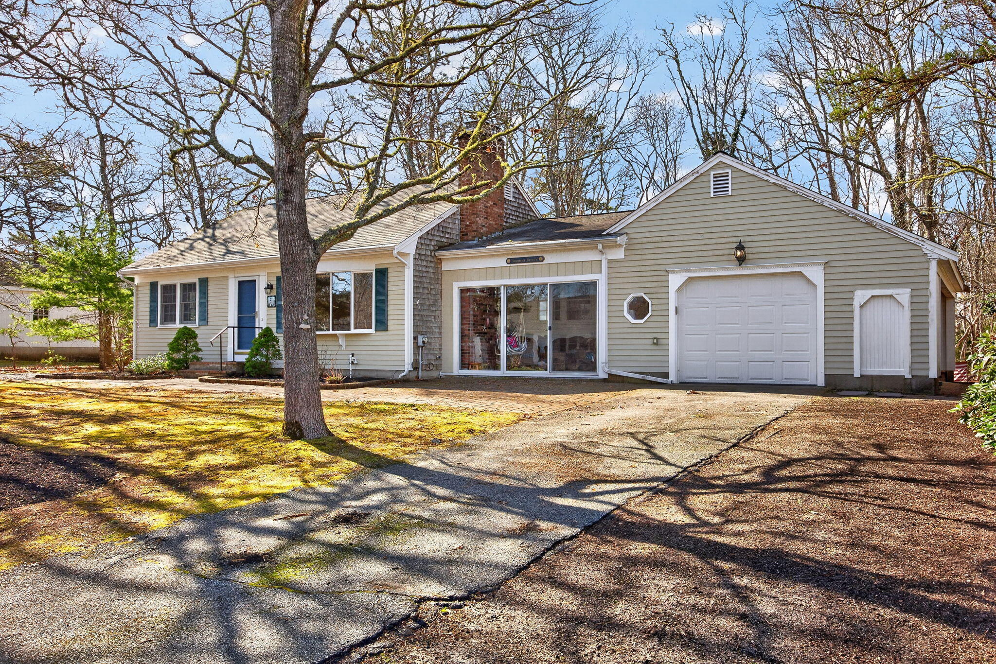 12 Inkberry Lane Harwich, MA 02645 - Photo 27 of 41 a front view of a house with a yard and garage