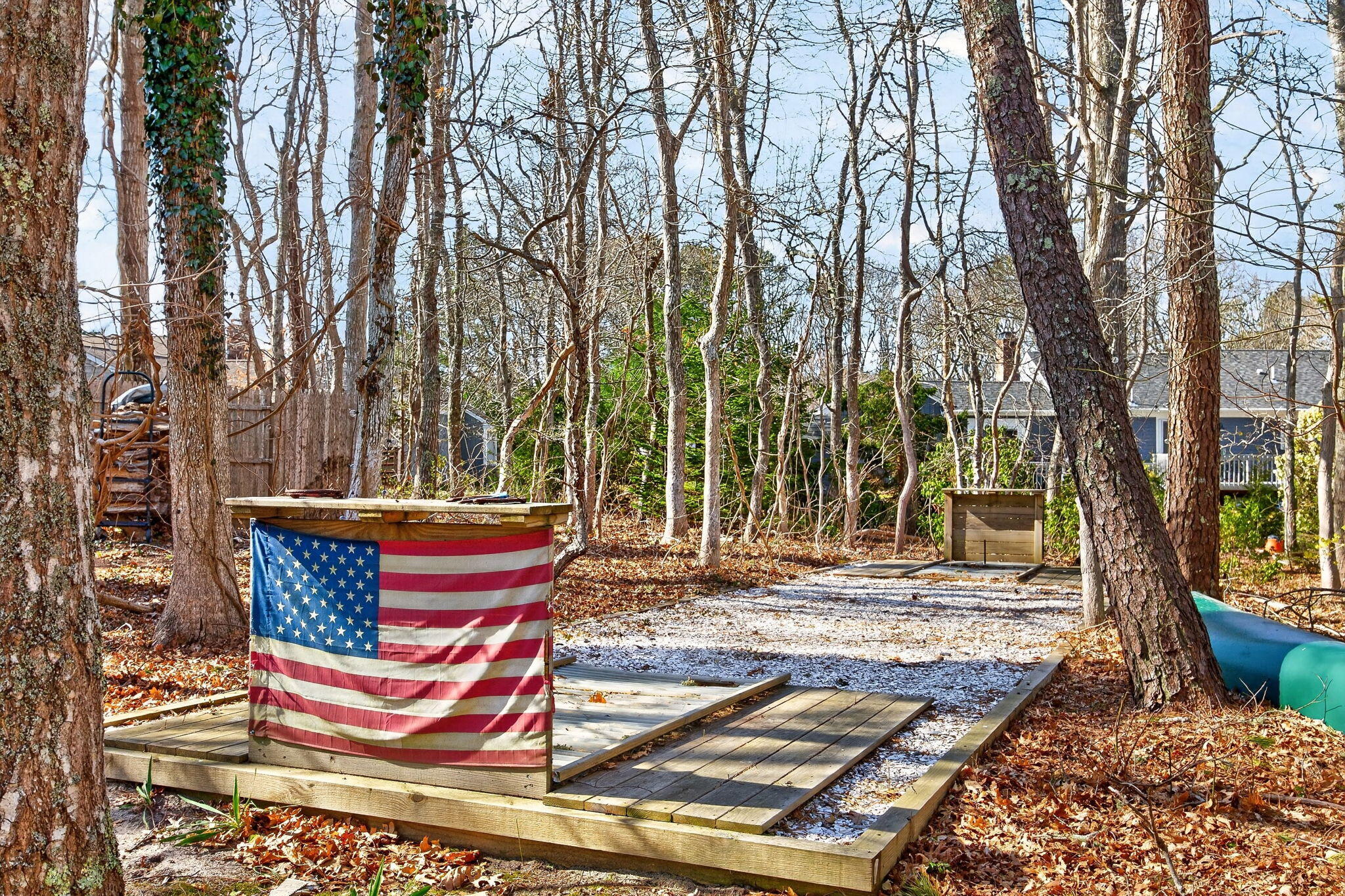 12 Inkberry Lane Harwich, MA 02645 - Photo 34 of 41 a wooden bench sitting in middle of a yard