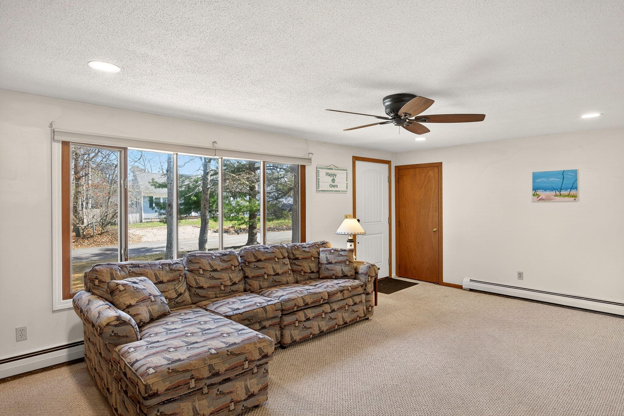 12 Inkberry Lane Harwich, MA 02645 - Photo 6 of 41 a living room with furniture and a large window