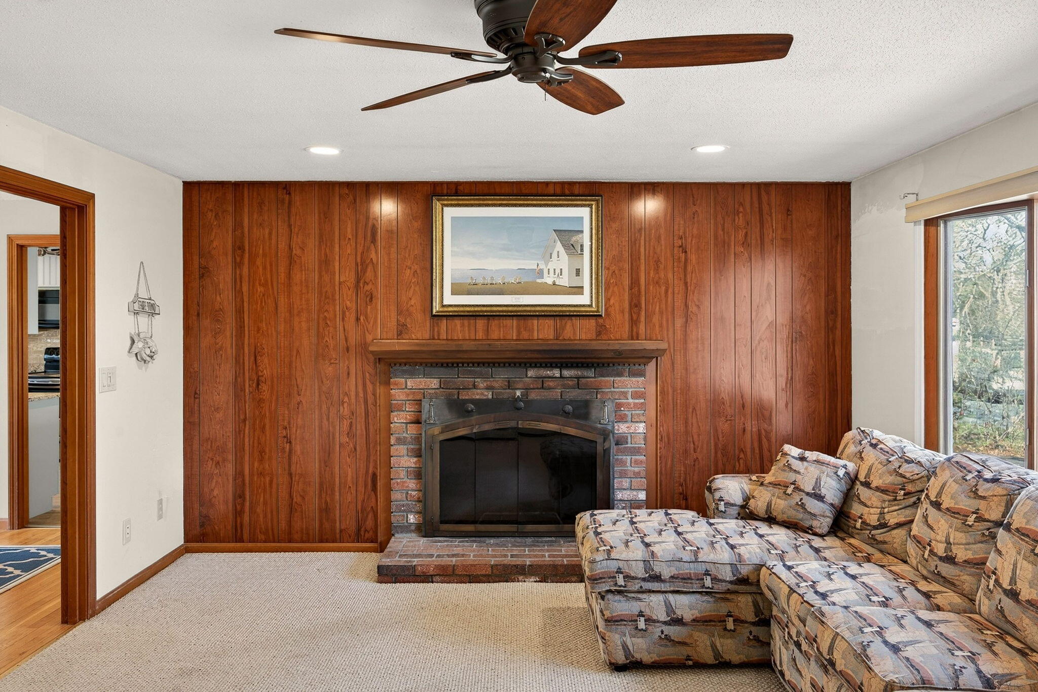 12 Inkberry Lane Harwich, MA 02645 - Photo 8 of 41 a living room with furniture and a fireplace