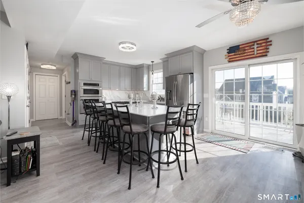 a kitchen with a white stove top oven and cabinets