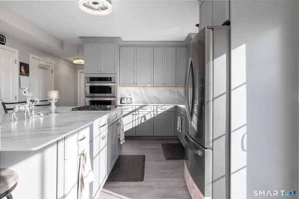 a bathroom with a sink a toilet and a window