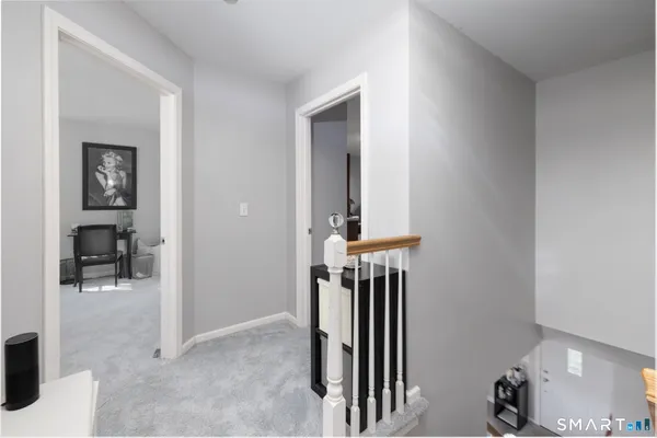 a spacious bedroom with a bed and a desk