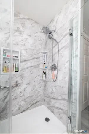 a bathroom with a double vanity sink and a mirror