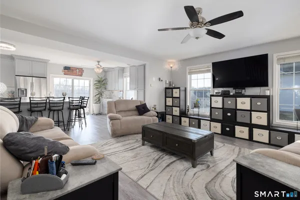 a living room with furniture and a flat screen tv