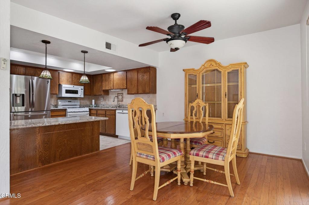 27127 Rio Bosque Drive Valencia, CA 91354 - Photo 2 of 11 a view of a dining room with furniture window and wooden floor